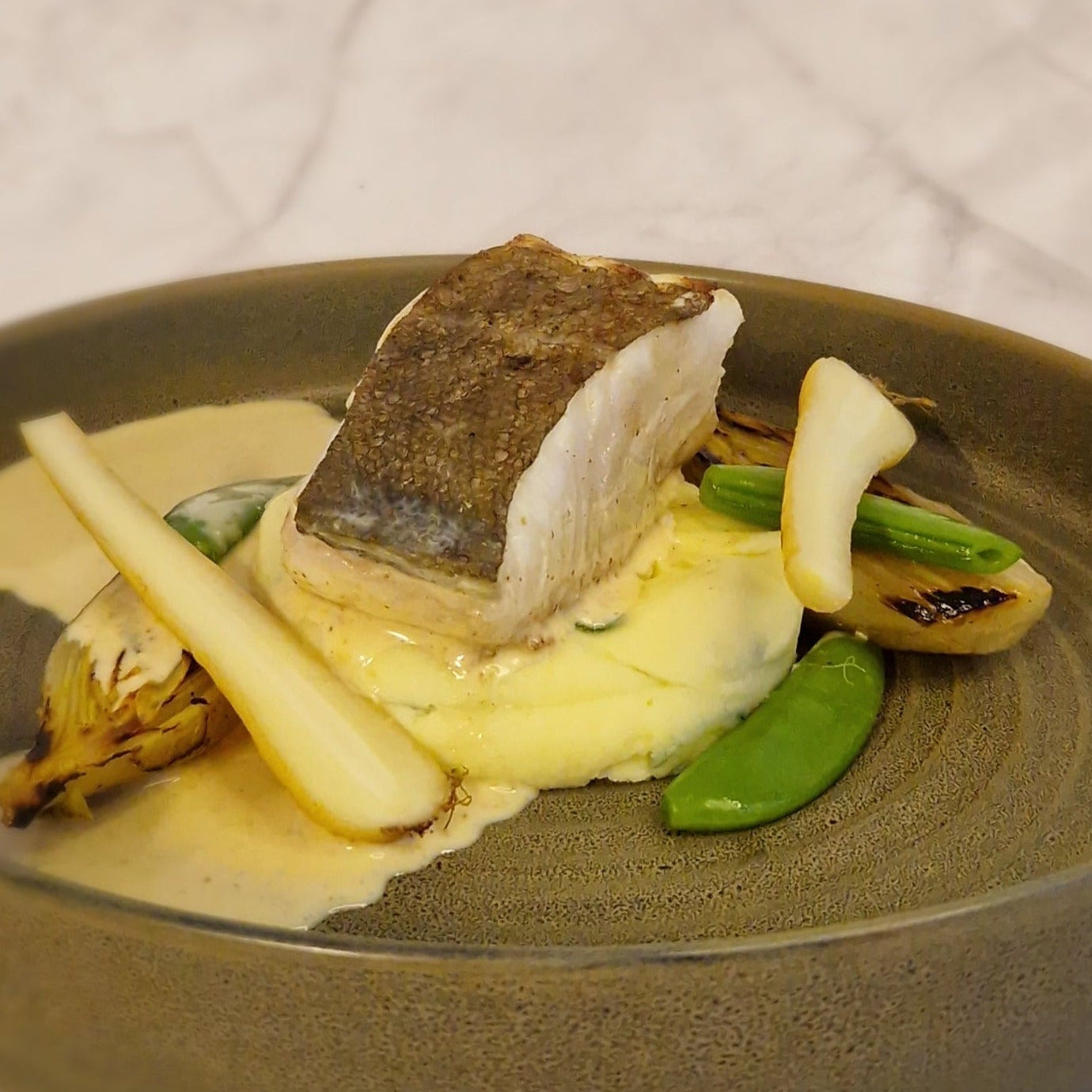 Skreifilet met aardappelpuree en wintergroenten